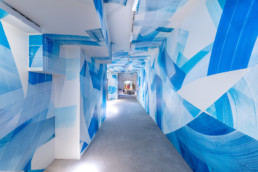 Art urbain au Printemps Haussmann – Fresque située dans le couloir menant à l’espace 7e Ciel
